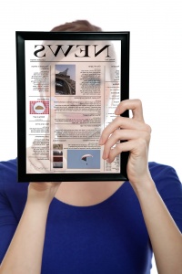 Woman Holding A Touchpad Pc, Reading A Newspaper