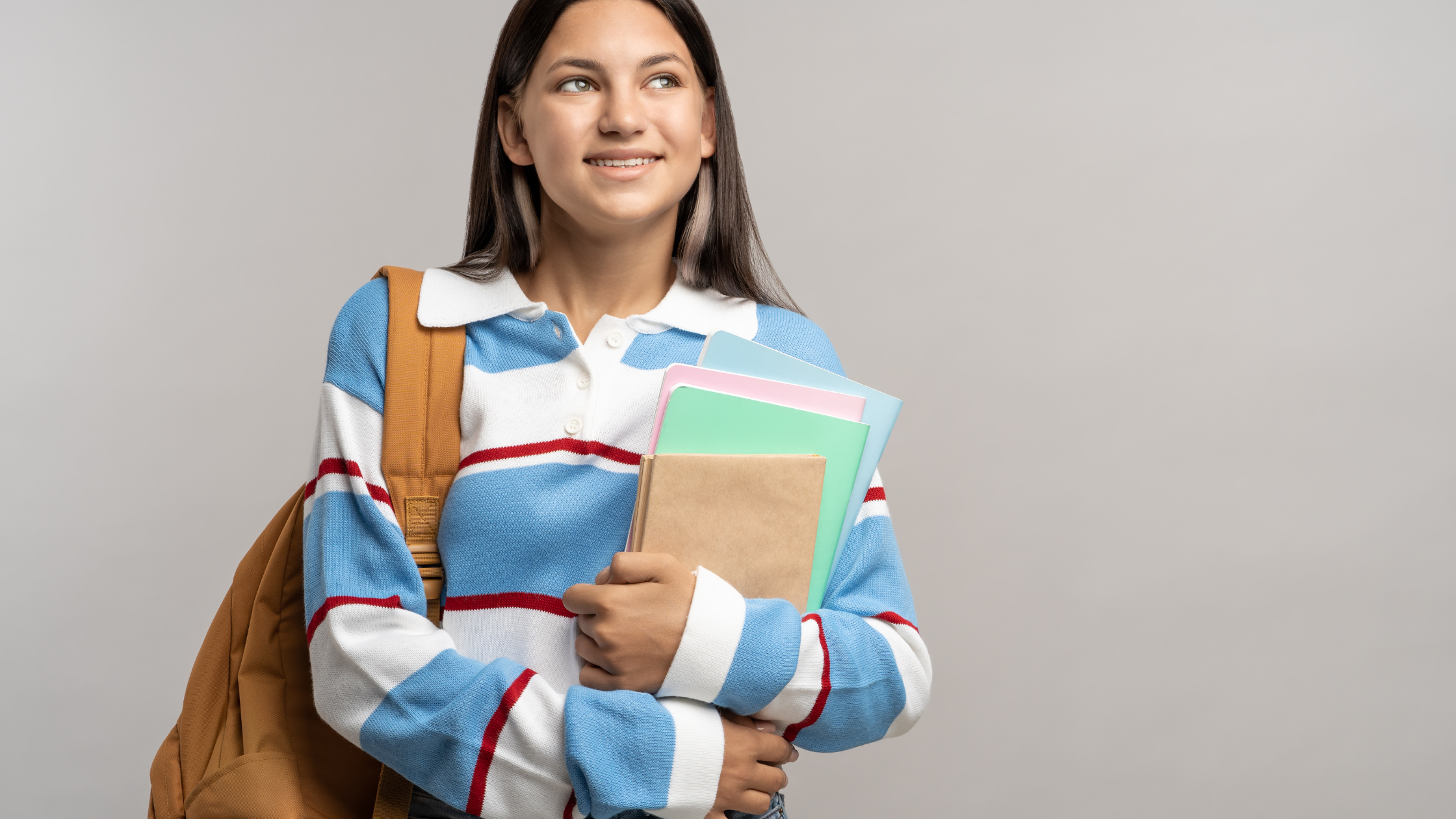 High school girl with books thinking about college